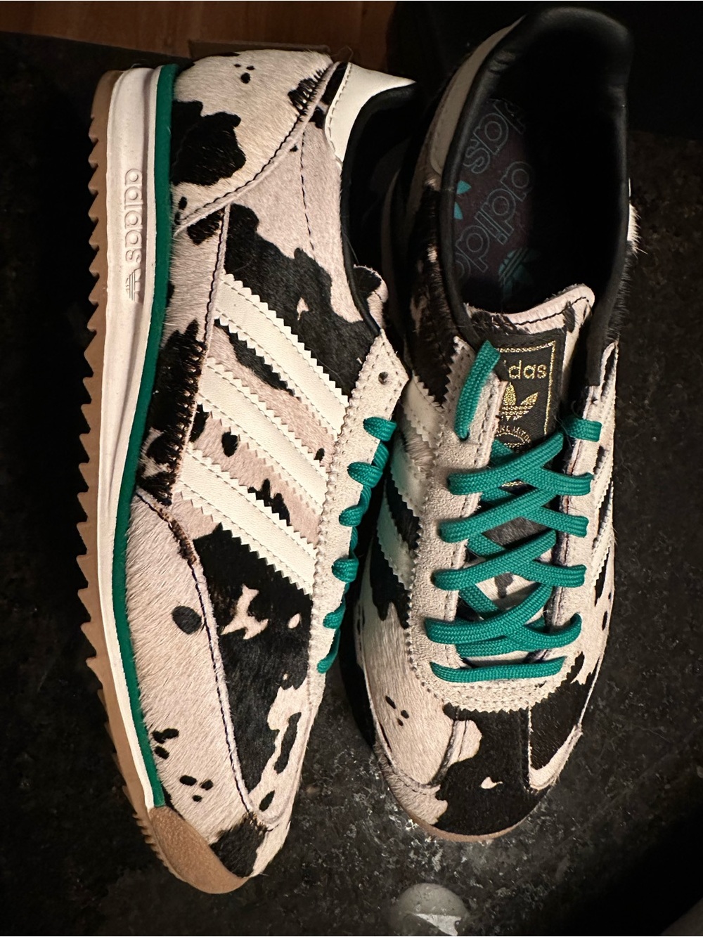 Adidas women’s Black & White Cow Print Sneakers with Teal Accents